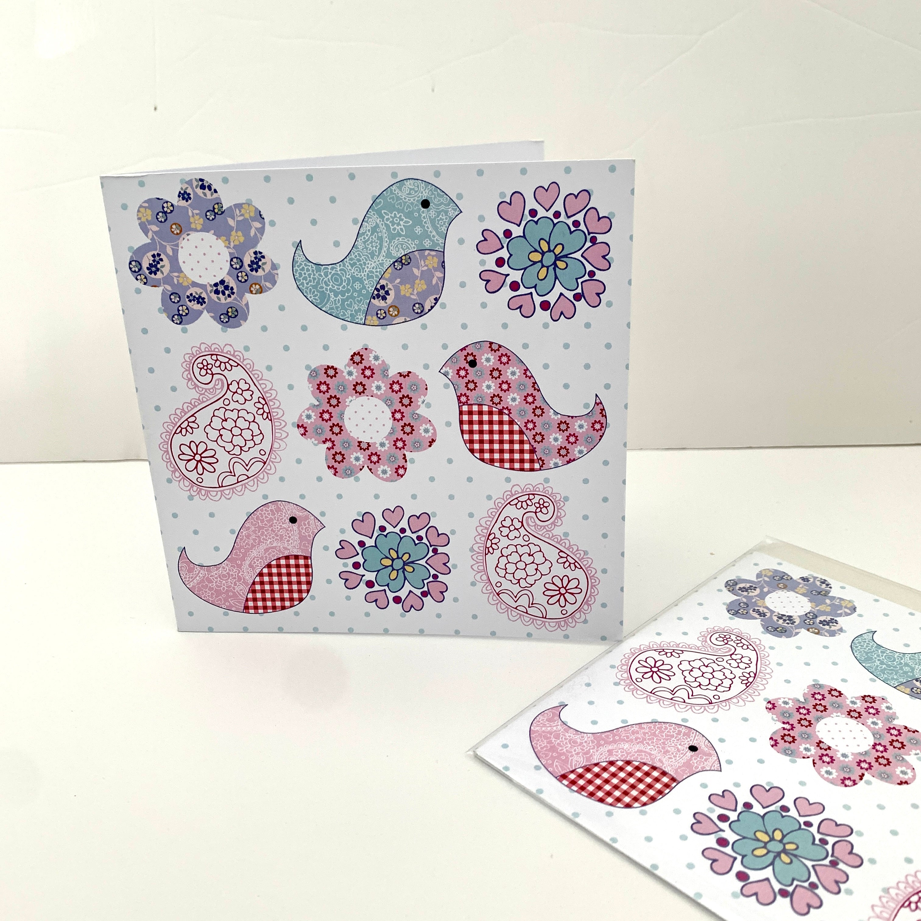 Greeting card with flower, bird and paisley.
